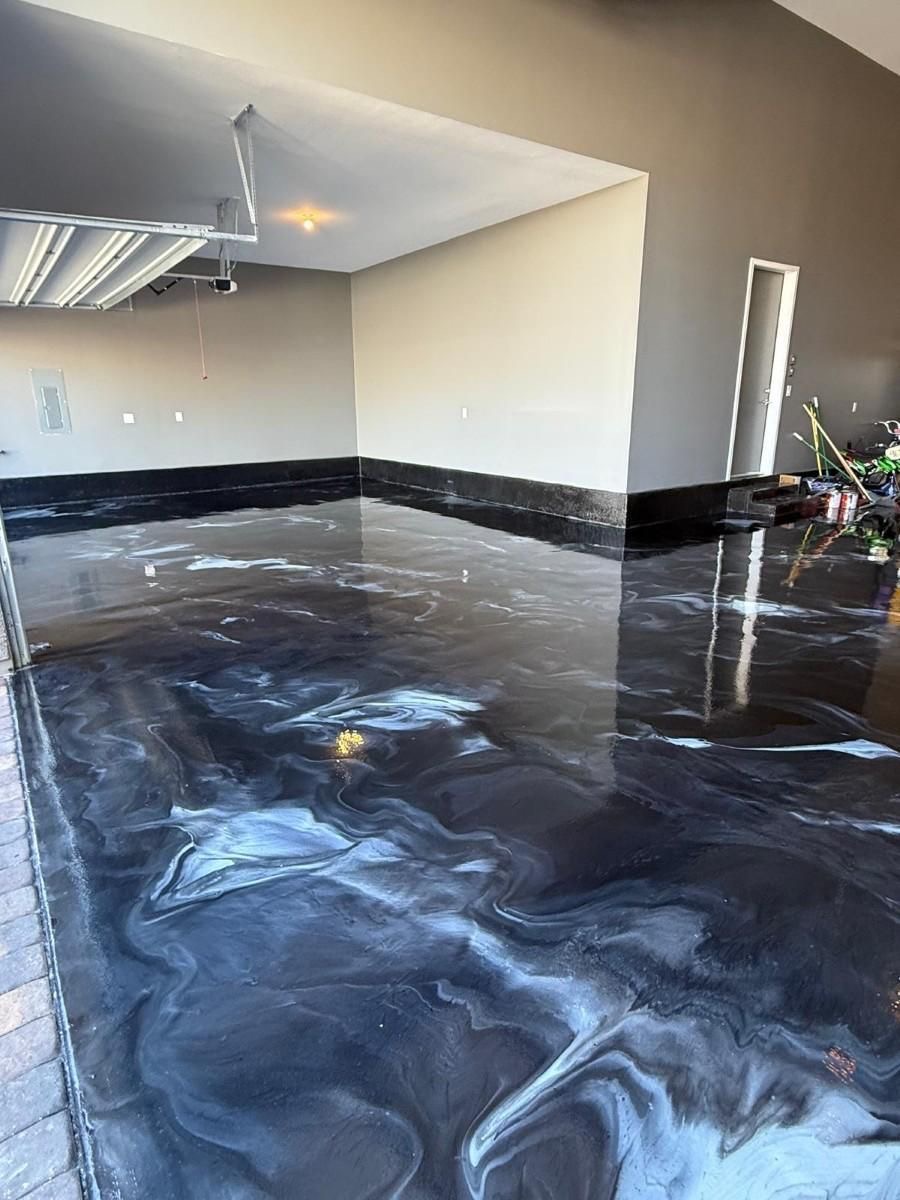 Metallic epoxy floor with a dark marble-style finish